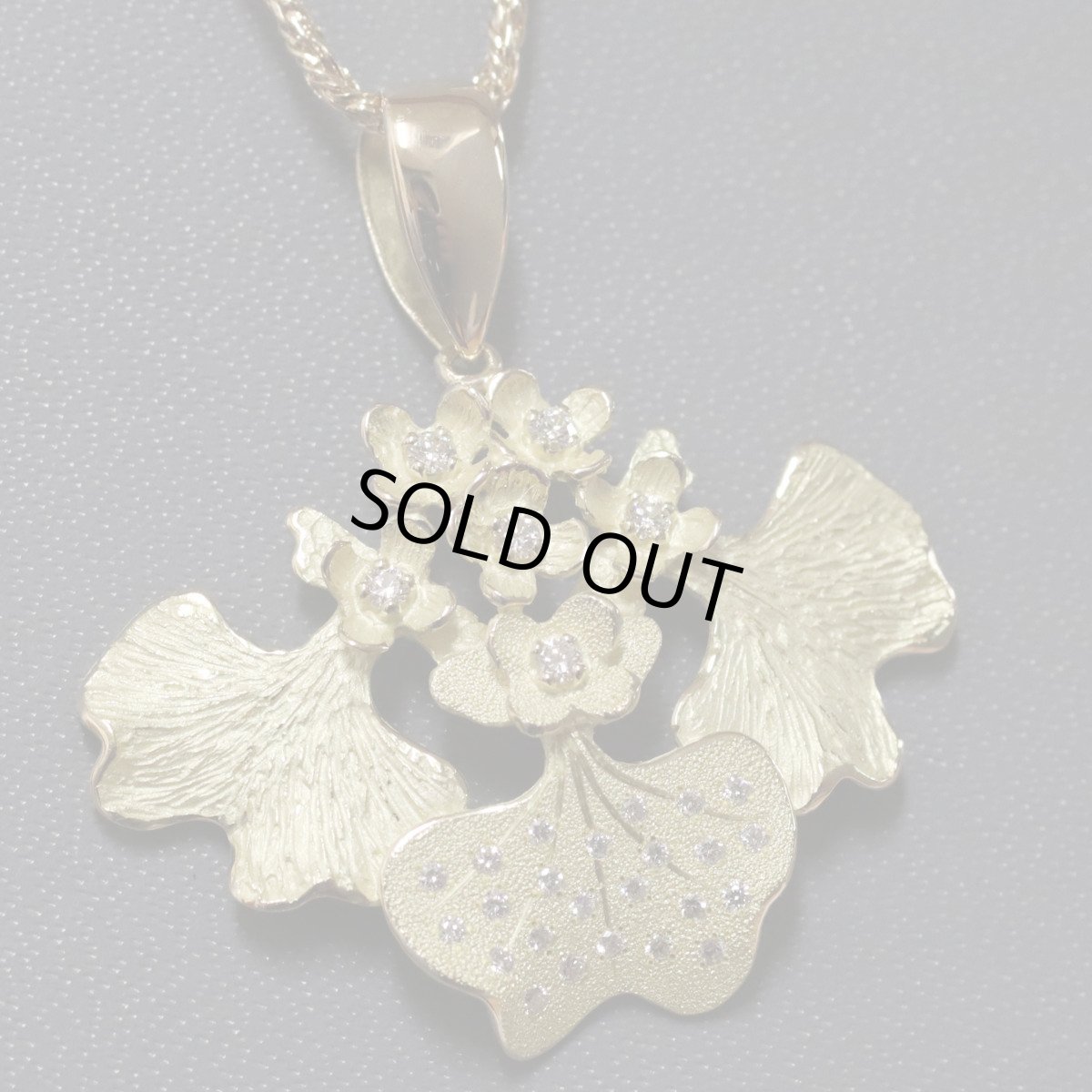 画像1: AKコレクション 750ダイヤモンドペンダント リーフモチーフ D0.27 9.2g 40cm (1)